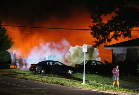 Click on image to see full-sized version Wreathed in smoke and tear gas like a military "warzone". But this is just the US town of Ferguson