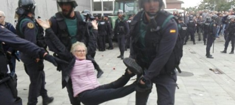 paramilitary Guardia Civil manhandle a civil rights activist & pacifist who had mobilised to protect the voting process.